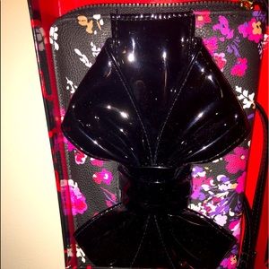 BNWT FLORAL WRISTLET/WALLET WITH LARGE BLACK BOW IN FRONT